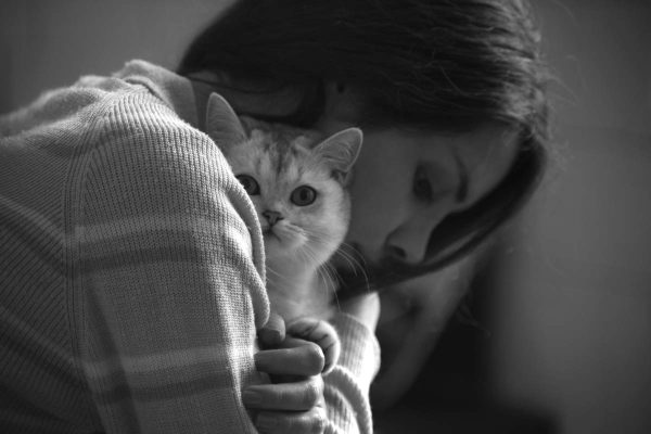 Woman hugging the cat